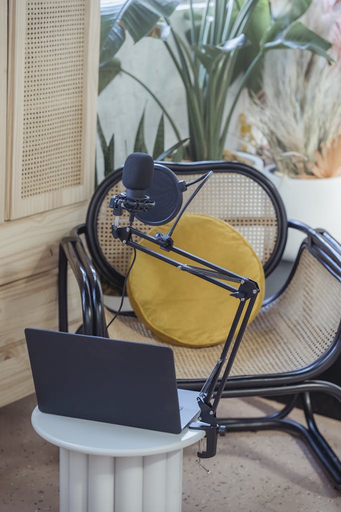 Microphone and laptop set up to record a podcast